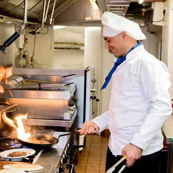 Kennedy Meadows Chef Created Meals, chef frying a dish.