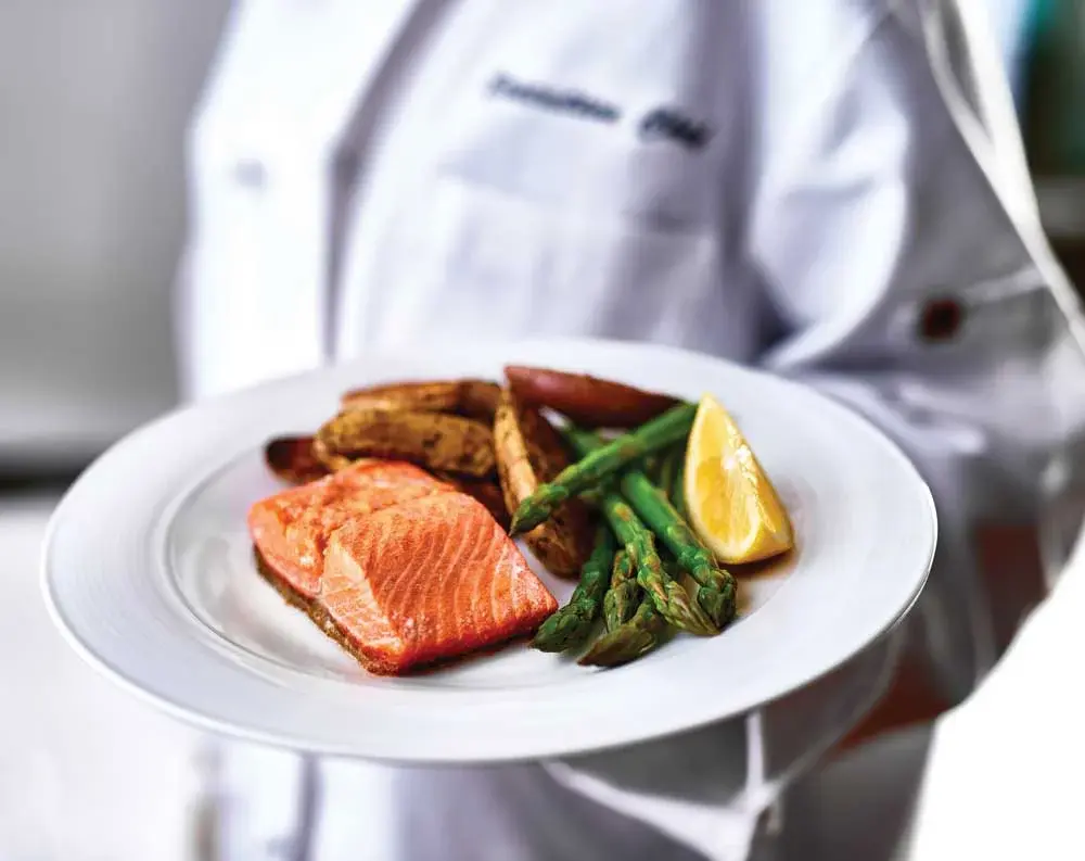 Kennedy Meadows Chef Created Meals, chef delivering a finished dish.
